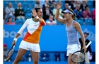 EASTBOURNE, ENGLAND - JUNE 21:  Flavia Pennetta of Italy and Martina Hingis of Switzerland celebrate winning a point during the Women's Doubles Final at the Aegon International at Devonshire Park on June 21, 2014 in Eastbourne, England.  (Photo by Ben Hoskins/Getty Images)